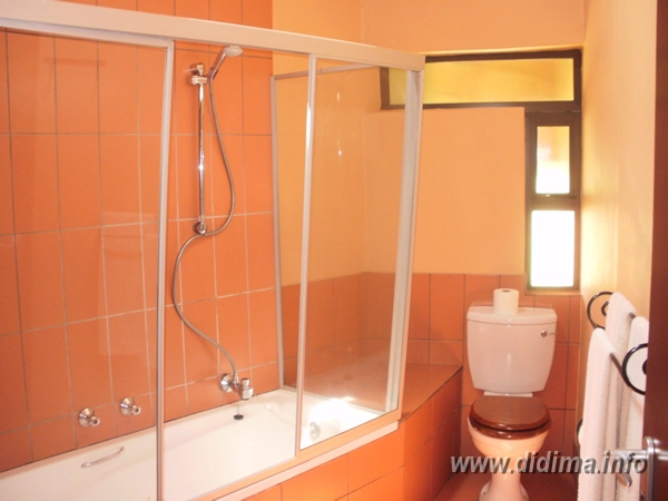Private bathroom with shower and toilet in a two-sleeper Didima Camp chalet