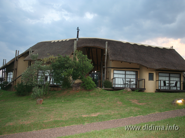 Traditional thatched chalet with mountain views at Didima Camp in the Cathedral Peak Valley
