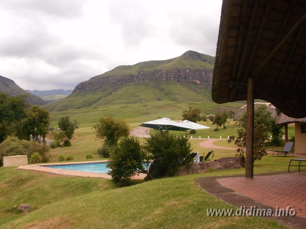 Didima Camp swimming pool and Drakensberg mountain scenery in the Cathedral Peak valley